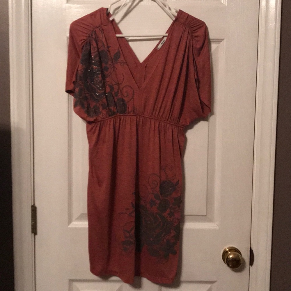 Light rust color with grey print